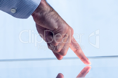 Man pointing on reflective surface