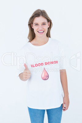 Blood donor showing thumbs up