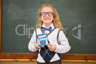 Smiling pupil holding calculator