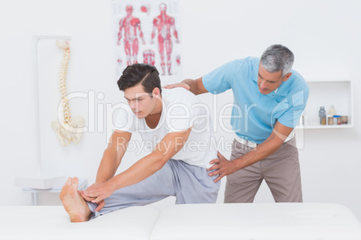 Doctor examining his patient back