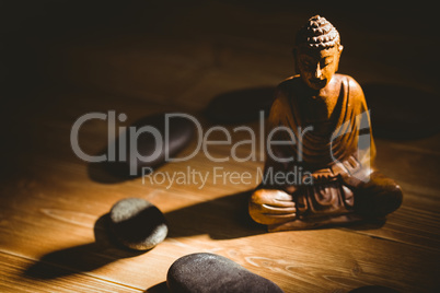 Wooden buddha statue on table