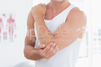 Young man suffering from elbow pain