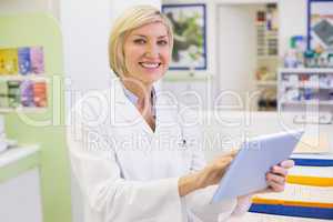 Junior pharmacist using tablet pc