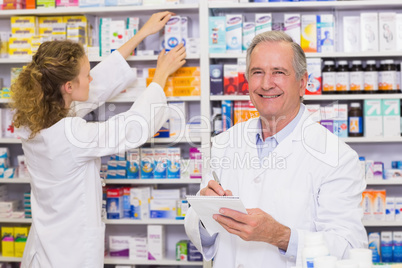 Pharmacists searching medicines with prescription