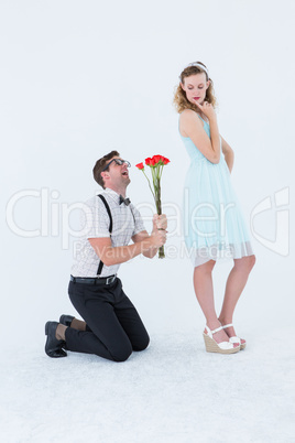 Geeky hipster begging his girlfriend taking roses