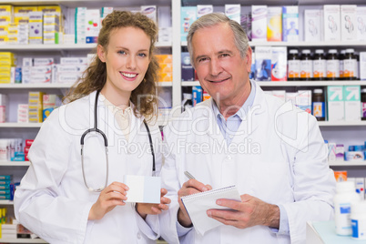 Pharmacist looking a medication for a prescription