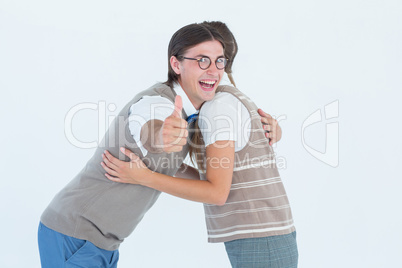 Geeky hipster couple hugging