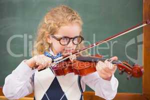Cute pupil playing the violin