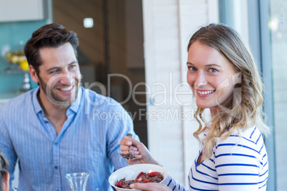 Happy couple having breakfast together