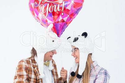 Geeky hipster in love couple looking at each other