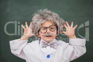 Cute dressed up pupil showing his hands