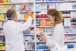 Pharmacists searching medicines with prescription