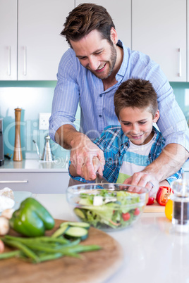 Happy family preparing vegetables together