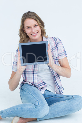 Pretty hipster showing her tablet