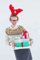 Happy geeky hipster holding presents