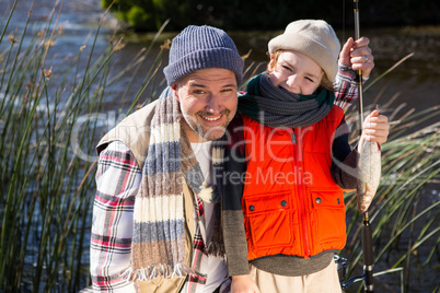 Happy man fishing with his son