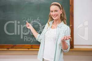 Teacher explaining maths in blackboard