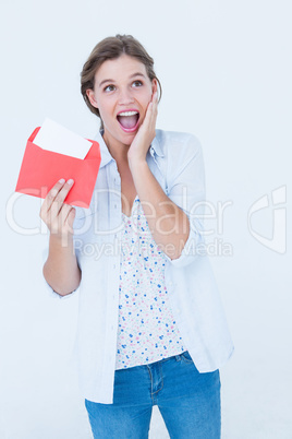 Smiling woman reading letter