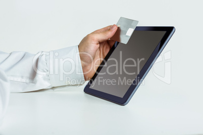 Man using tablet for online shopping