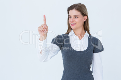 Smiling woman pointing something with her finger