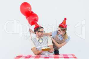 Geeky hipster couple celebrating his birthday