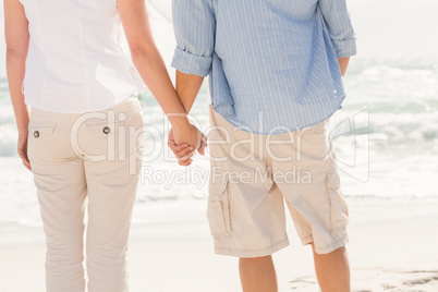 Happy couple looking out to sea