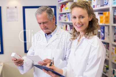 Pharmacists looking a medication for a prescription