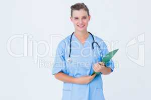 Smiling nurse holding clipboard