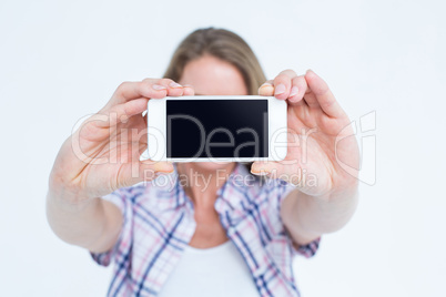 Pretty hipster taking selfie with smartphone