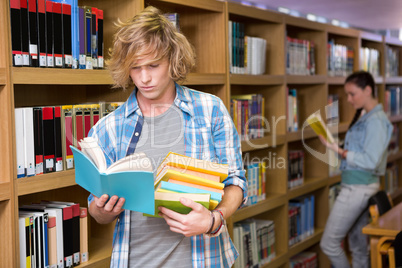 Student reading in library