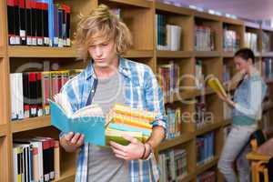 Student reading in library