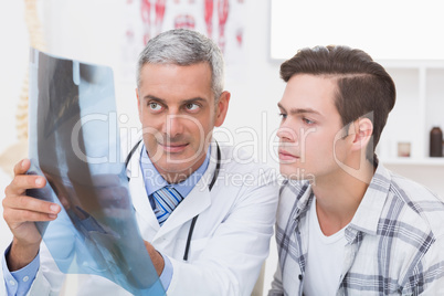 Doctor showing X rays to his patient