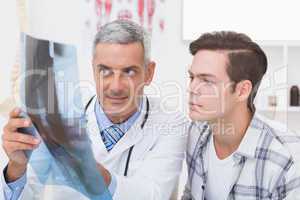 Doctor showing X rays to his patient