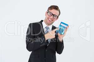 Geeky businessman pointing to calculator