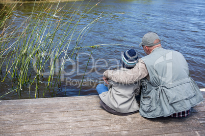 Father and son at a lake