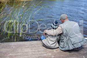 Father and son at a lake