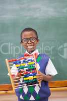 Smiling pupil holding abacus