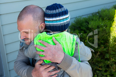 Father and son hugging