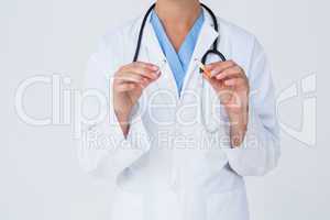 Doctor holding broken cigarette as incentive to quit
