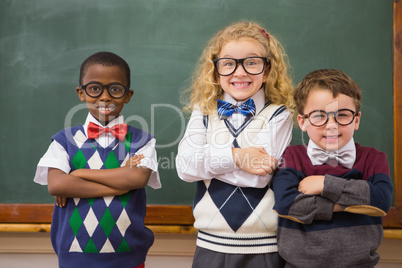 Pupils smiling at camera with arms crossed