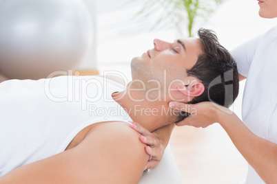 Man receiving neck massage