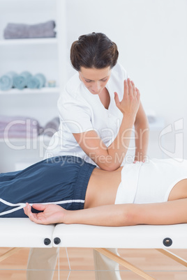 Physiotherapist doing back massage Physiotherapist doing back massage