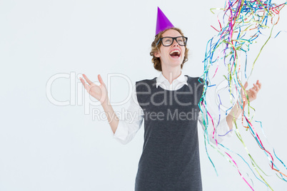 Happy geeky hipster wearing a party hat