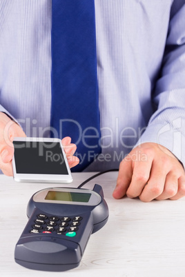 Man using smartphone to express pay