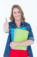 Smiling student holding notebook and file