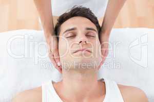 Man receiving neck massage