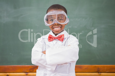 Chemistry pupil smiling at camera with arms crossed