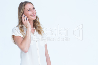 Smiling woman calling with her smartphone Smiling woman calling with her smartphone