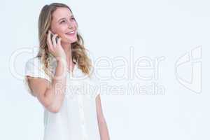 Smiling woman calling with her smartphone