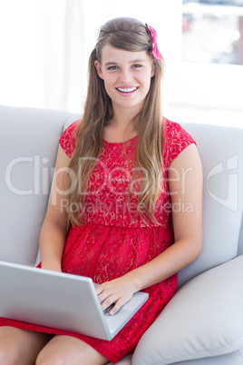 Pretty hipster using her laptop